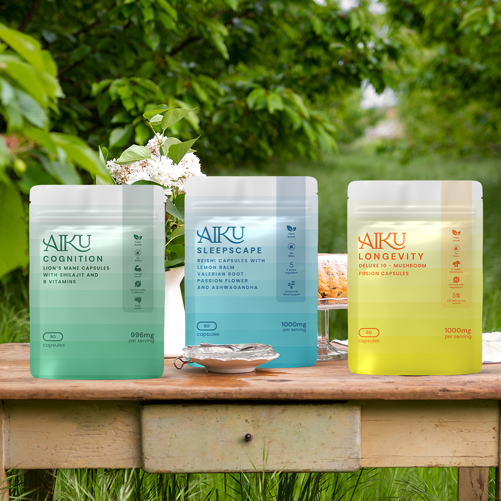 Three Aiku supplement packages on a wooden surface with a natural background