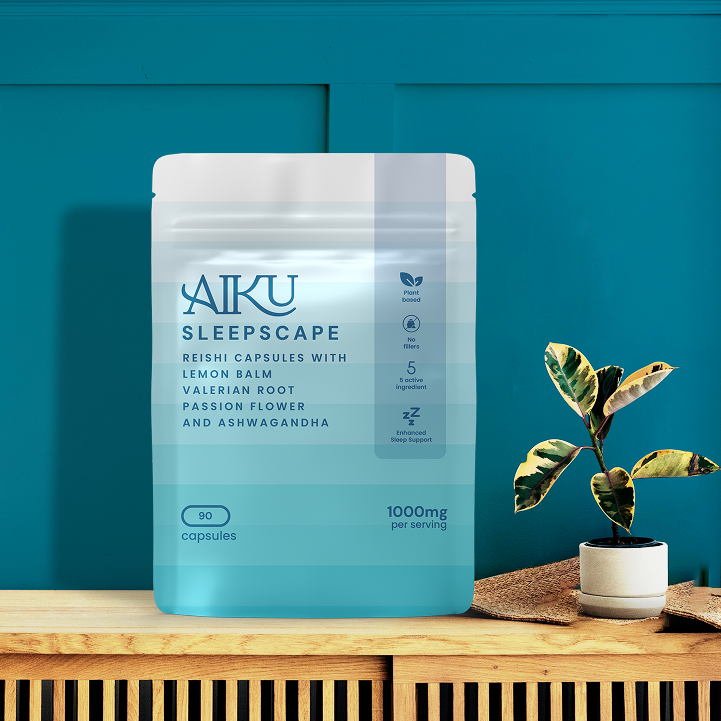 Aiku Sleepscape supplement package on a wooden surface with a plant against a blue wall