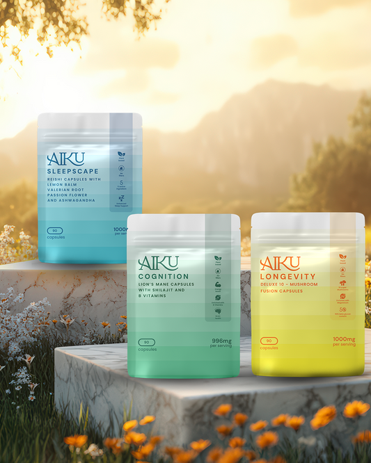 Three Aiku supplement containers on a stone ledge with a scenic background